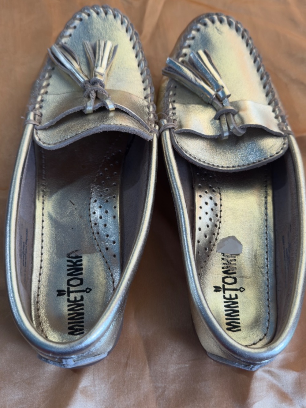 Gold Minnetonka moccasins with tassel on front - Women's 8.5